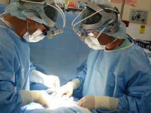 Doctors performing a laparoscopic surgery